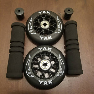 2x 100mm black skate or scooter wheels with handle bar grips